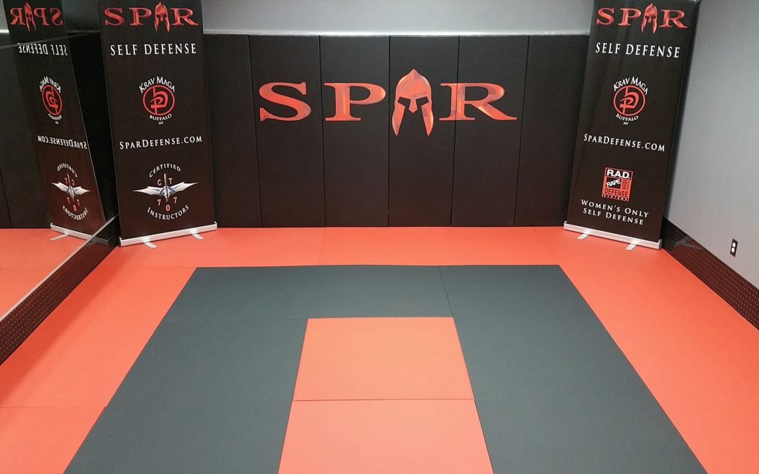 Is it Better to Use Wood-backed Wall Pads or Roll-out Mats?